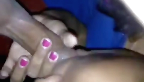 Indian milf milking her man's boner with her hands