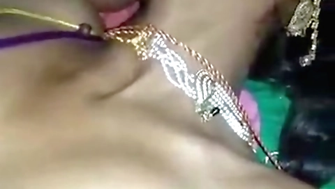Sexy indian chick in a sexy dress is playing with her hands
