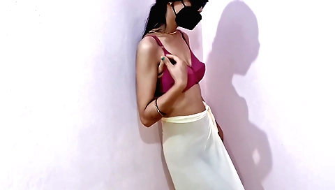 Brunette with a sexy body makes an erotic dance on her couch
