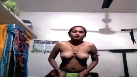 Indian girl in a white dress is doing solo in the webcam