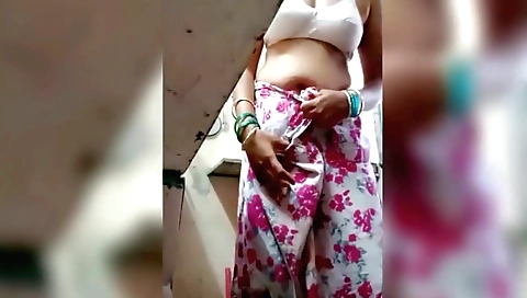Indian brunette naked in kitchen showing her boobs