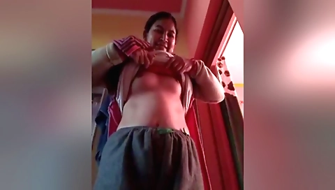 Bhabhi is a sexy brunette in a sexy outfit in this solo video