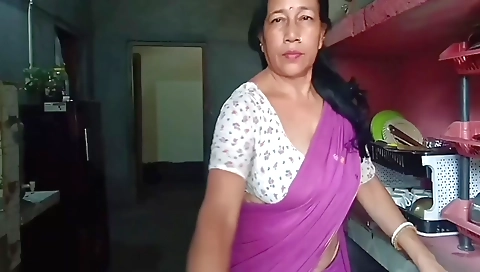 Indian village woman wearing a bikini out in the field
