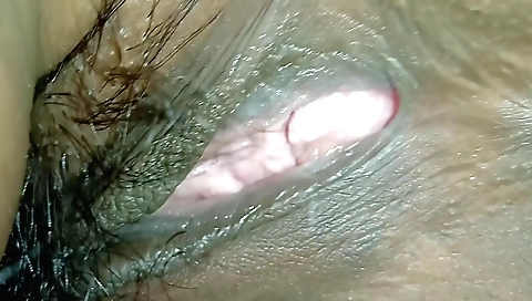 Hairy babe masturbating on the camera on her ass pov
