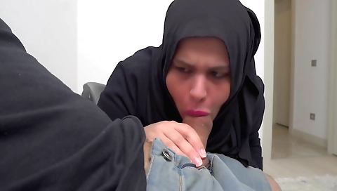 Hot brunette girl in a hijab is making out with a man