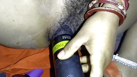 Hairy brunette girl rides a dildo in her hairy pussy