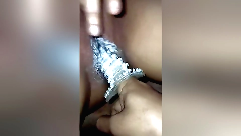 Indian babe in a sexy dress has a toy inside her pussy