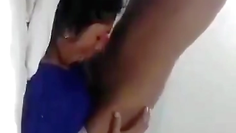Black hairy whore in red dress plays with her mouth