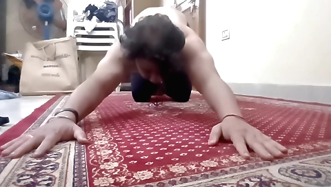 Girl stretches her arms and legs to her limit during hard workout