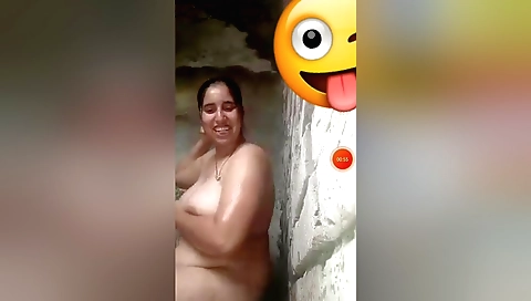 This amateur video shows a young Indian slut bathing